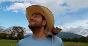 Ratbot: Landmine hunter Andrew McGregor with rat perched all up ons him.