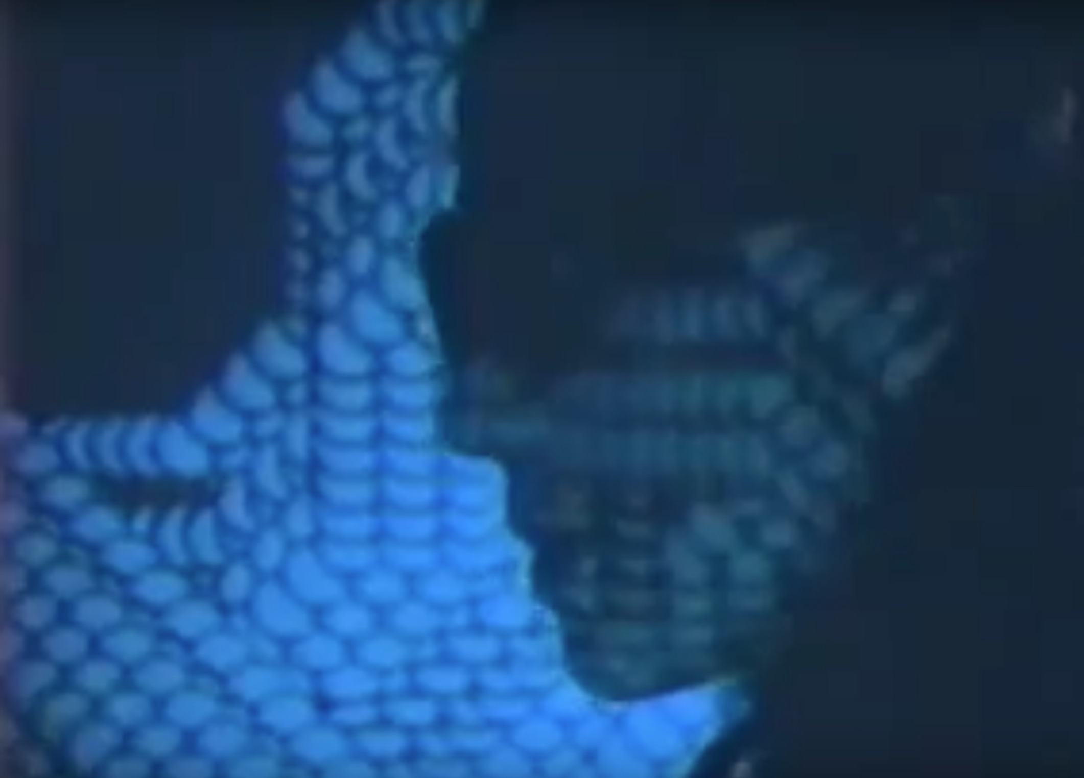 Profile of a womans face lit by projected computer graphics