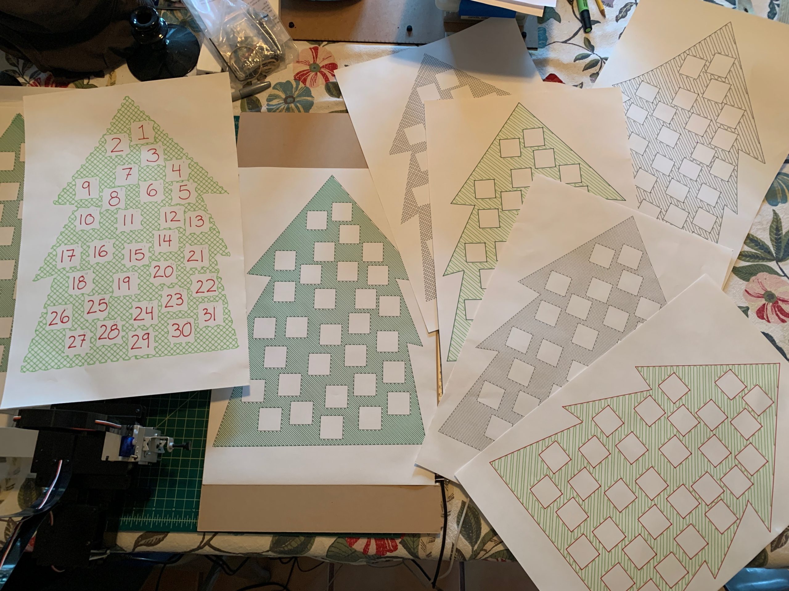 a collection of cartoon like fir trees with boxes cut out of them