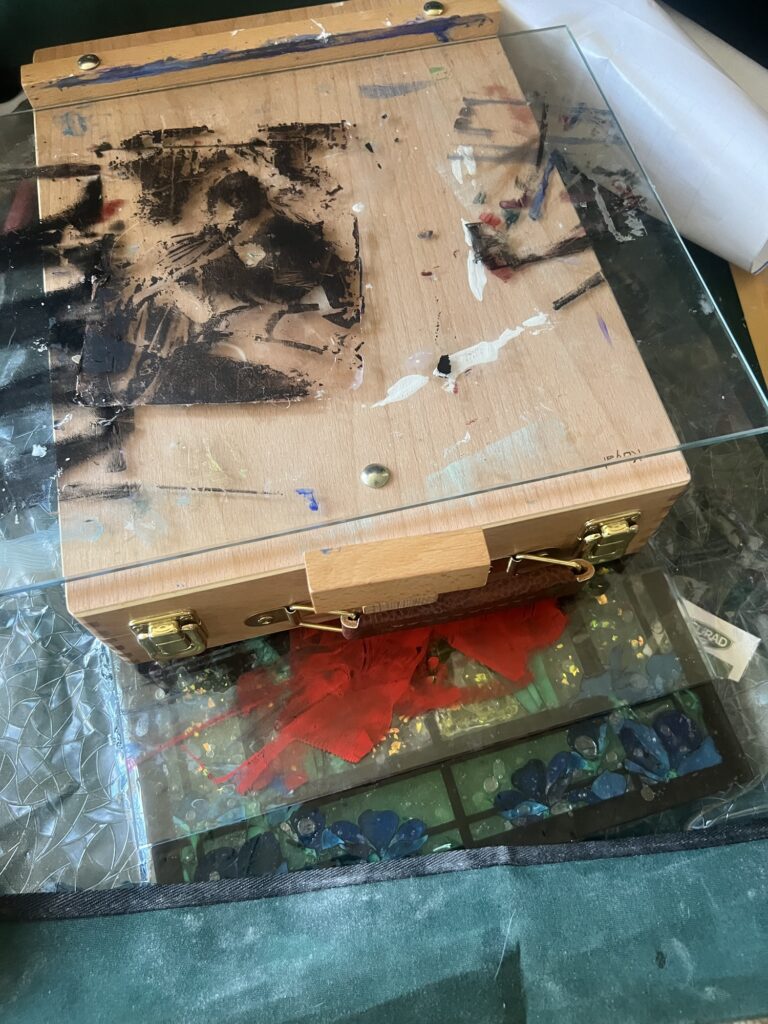 stained glass laser cut project shown with texture overlay, two panes of glass, and a portable easel stacked on top