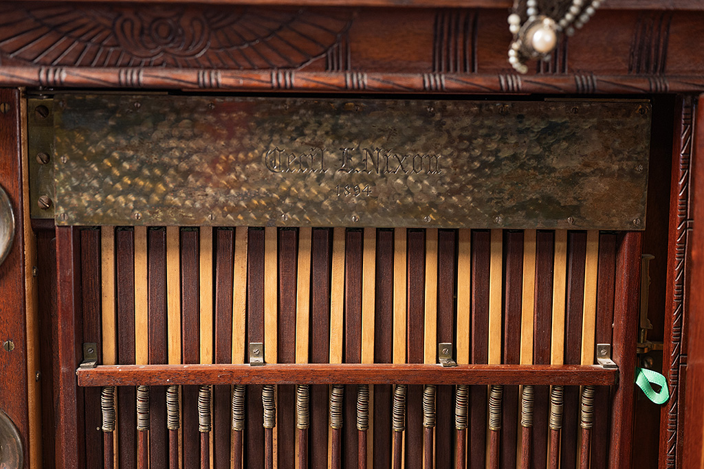 Close-up view of one of the interior openings, with a machined plate that is engraved "Cecil E. Nixon - 1894"